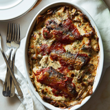 Cooked with sardines in spicy tomato, served on a platter.